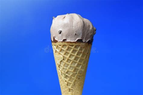 Chocolate Ice Cream Cone on Blue Background Stock Photo - Image of ...