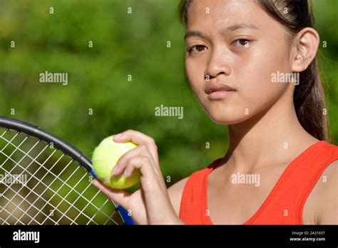 Unemotional Girl Tennis Player With Tennis Racket Stock Photo Alamy