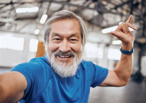 Fitness Selfie And Portrait Of Asian Man In Gym With Hand Sign For Motivation Wellness And