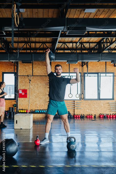 Two People Working Out in Gym Stock Photo | Adobe Stock