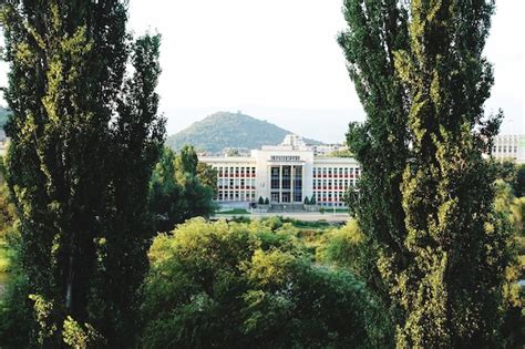 Premium Photo | Plovdiv university between two trees