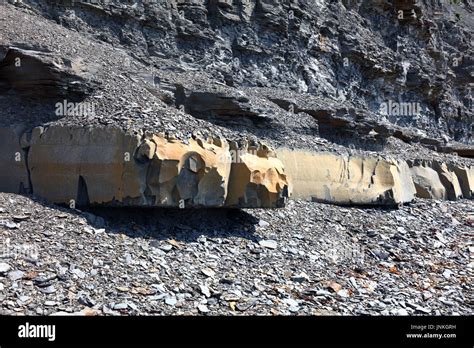 Geological Cliff Structures With Limestone And Soft Crumbling Oil