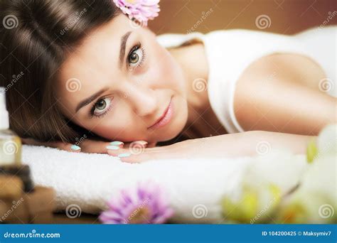 Massage Beautiful Woman At The Spa Gentle Look Flowers In Hair The