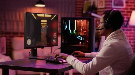 Premium Photo Handheld Shot Of African American Man Using Pc Gaming