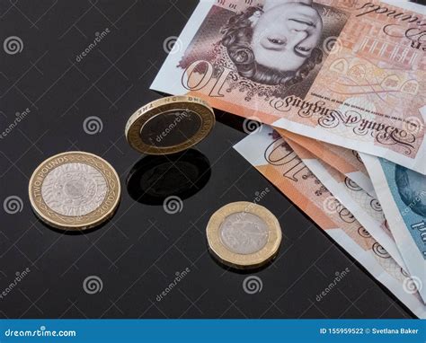 British Currency Notes and Coins on the Glass Table. Editorial ...