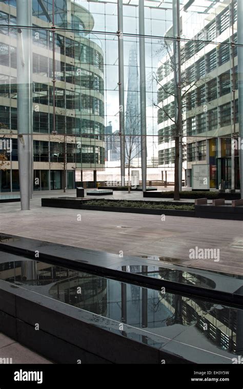 The Shard From Tower Place Through Glass Panels Of A Courtyard Stock