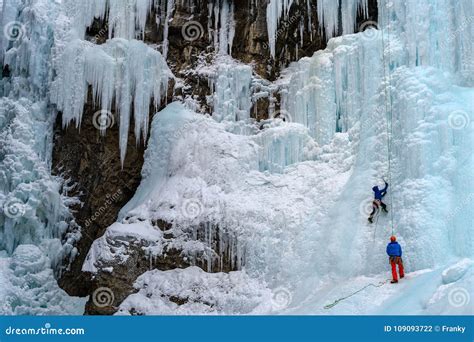 Ice Climbers On The Frozen Waterfalls In Johnston Canyon Banff