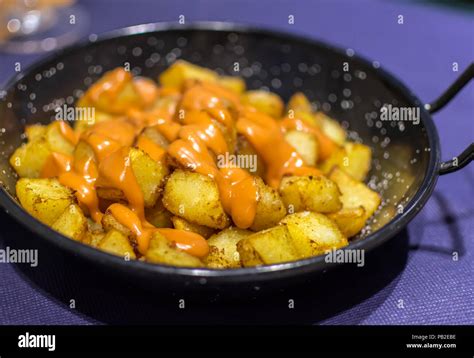 Patatas Bravas Spanish Fried Potatoes With Spicy Orange Colored Salsa