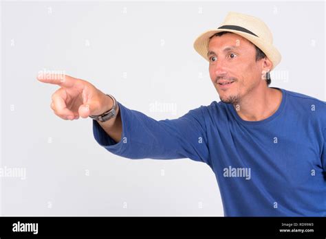 Happy Mature Tourist Man Pointing Finger Ready For Vacation Stock Photo