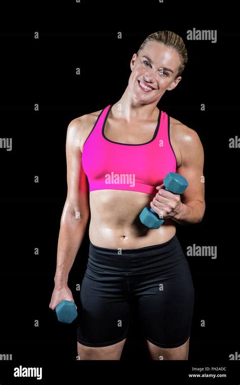 Muscular Woman Lifting Heavy Dumbbells Stock Photo Alamy