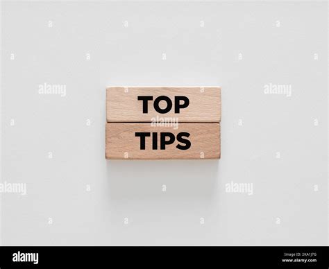 The word top tips on wooden blocks on white background Stock Photo - Alamy