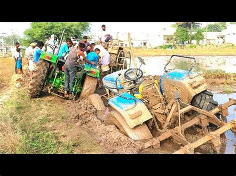 New Holland And JohnDeere Tractors Stuck In Mud Rescued By Mahindra