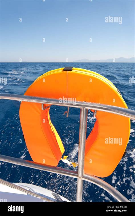 Orange Lifebuoy On Sailing Ship Stock Photo Alamy