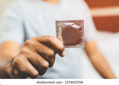 Male Hand Holding Condom Safe Sex Stock Photo 1374453704 Shutterstock