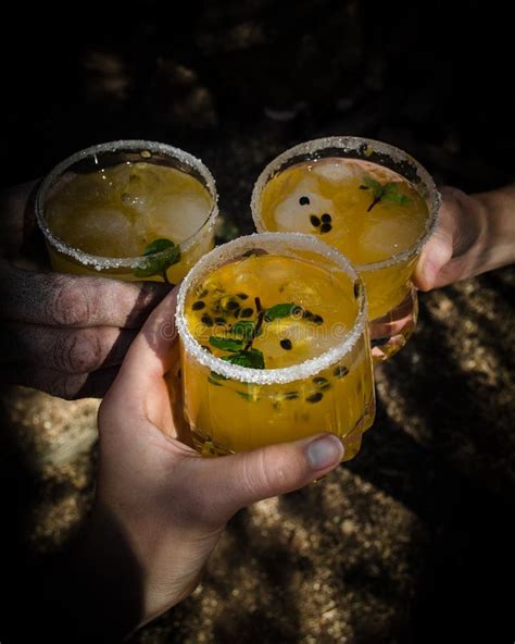 Fresh And Tropical Cocktail With Passion Fruit Lime Mint And Ice