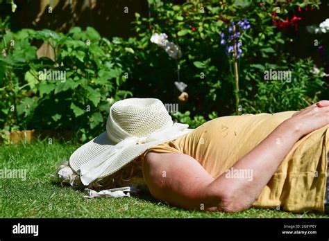 Mature Woman Sunbathing Garden Hi Res Stock Photography And Images Alamy