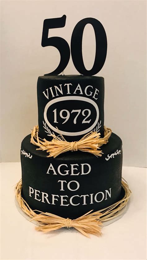 A Th Birthday Cake With An Aged To Perfection Sign On The Top And