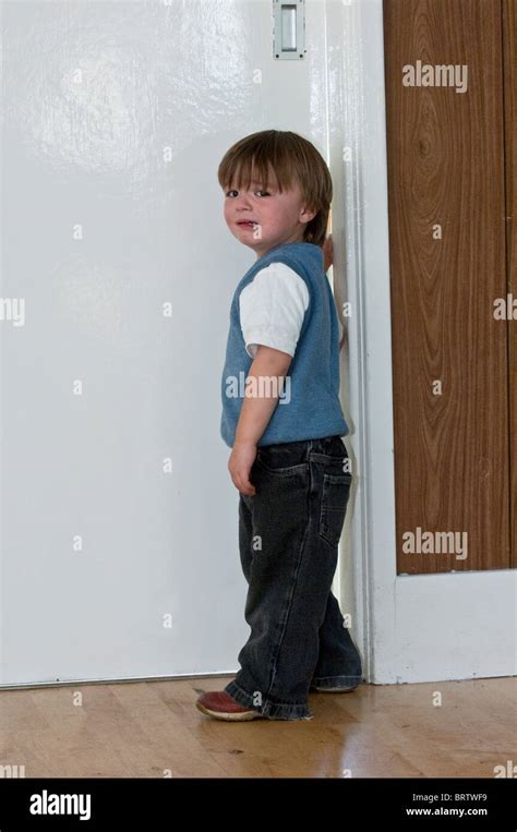 Young Child With His Fingers Trapped In A Door Stock Photo Alamy