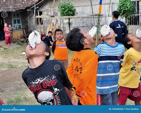 Group Of Kids Eating Crackers In The Eating Crackers Competition On