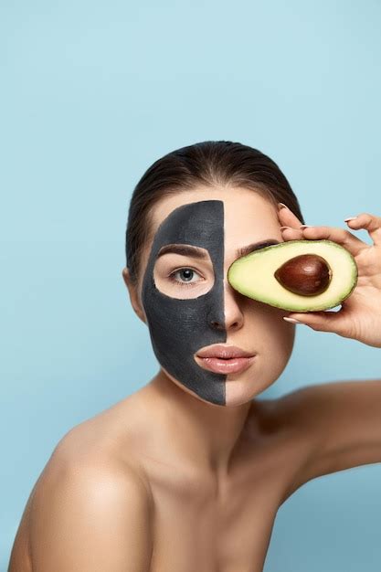 Beauty Facial Mask Beautiful Young Woman With Black Mask Of Clay On