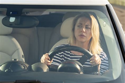 Premium Photo | Woman driver - car accident, yells in fear or frustration. student girl sitting ...