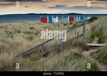 Findhorn Moray Coast Scotland A Row Of Colourful Beach Huts Overlooking