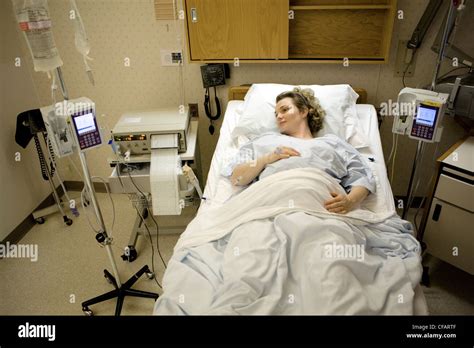 36 Year Old Woman About To Give Birth Lying In Hospital Bed