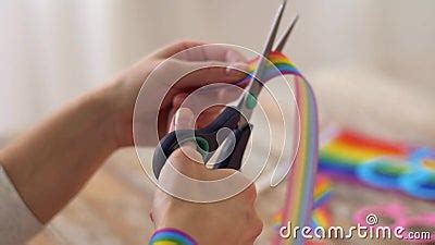 Hands With Scissors Cut Gay Pride Awareness Ribbon Stock Footage