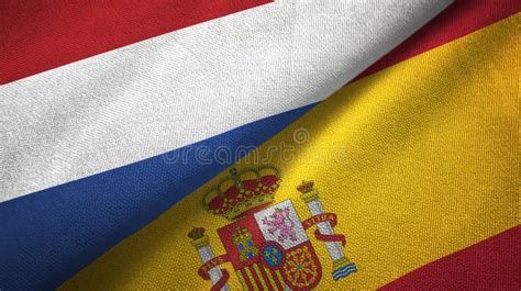 Netherlands And Spain Two Flags Textile Cloth Fabric Texture Stock