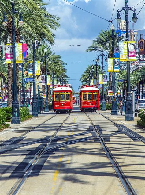 Red Trolley Streetcar On Rail In New Orleans French Quarter Editorial