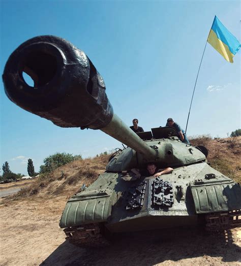 Ukrainian Government Soldiers With A Iosif Stalin Tank Captured From