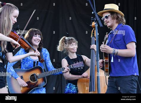 Molly Tuttle and Golden Highway are shown performing on stage during a ...