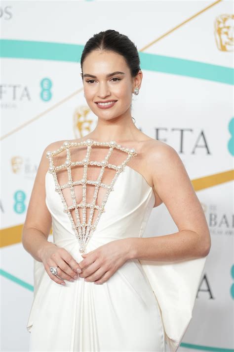 Lily James Wows In An Ultra Plunging White Gown At The 2023 BAFTAs