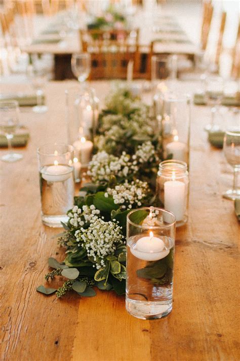 Floating Candles And Lush Greenery Runners With Babies Breath Pair