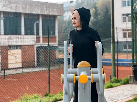 Premium Photo | A Muslim woman with a hijab is exercising early in the ...