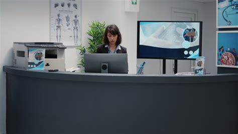 Portrait Receptionist Working Hospital Reception Desk Stock Footage Video (100% Royalty-free ...