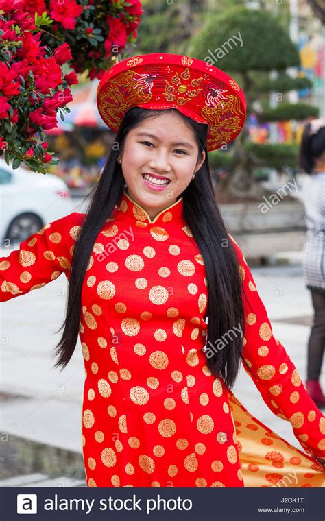 Vietnam, Haiphong, Tet Lunar New Year, young women wearing traditional ...