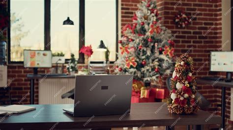 Premium Photo | Empty startup office decorated with christmas lights ...