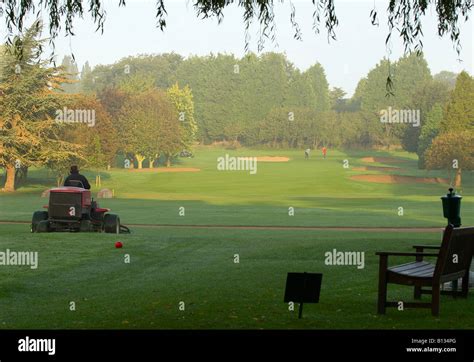 green keeper on golf course Stock Photo - Alamy