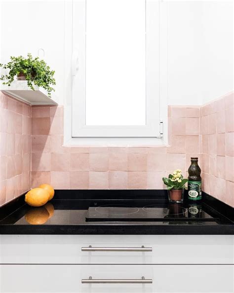 Pink Backsplash Tile In Contrast With White And Black Kitchen The
