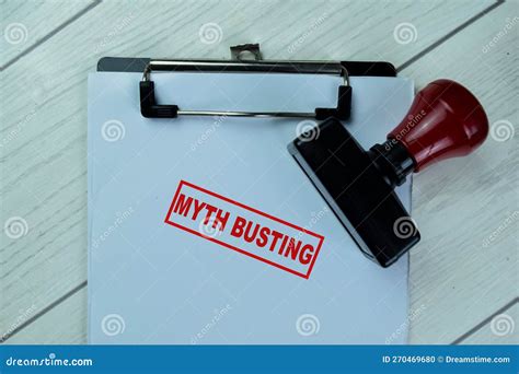 Concept Of Red Handle Rubber Stamper And Myth Busting Text Isolated On