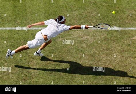 Marcos Baghdatis of Cyprus makes a forehand return to James Blake of the US during their first ...