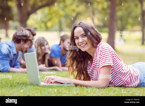 Pretty Brunette Using Laptop In The Park Stock Photo Alamy
