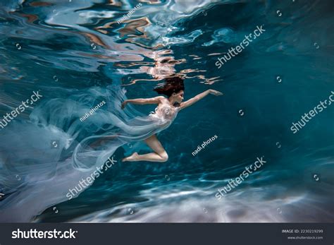 Girl In Dress Underwater