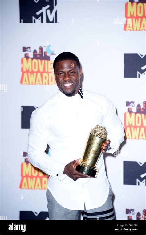 Actor Kevin Hart poses in the press room of The 2015 MTV Movie Awards ...