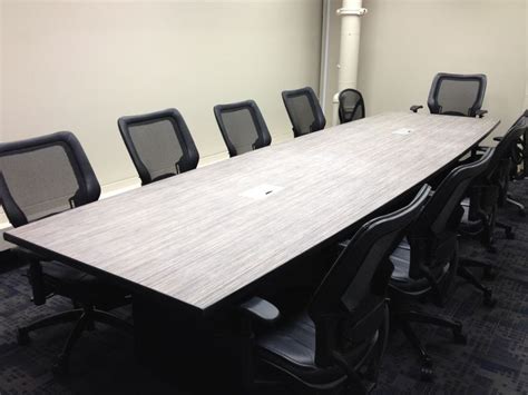 A large conference table complete with power outlets and USB ports.