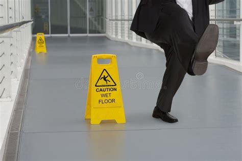 Man In Suit Slipping On Wet Floor Stock Photo Image 47878470