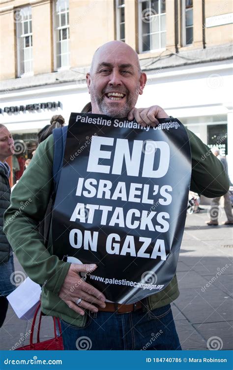 Man Holding Pro Palestine `end Israel`s Attacks On Gaza` Poster