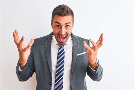 Young Handsome Business Man Wearing Suit And Tie Over Isolated