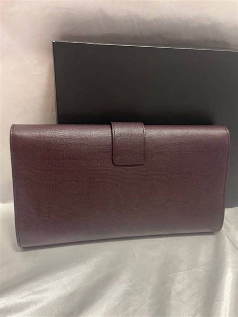 Ysl saint Laurent clutch bag, Luxury, Bags & Wallets on Carousell